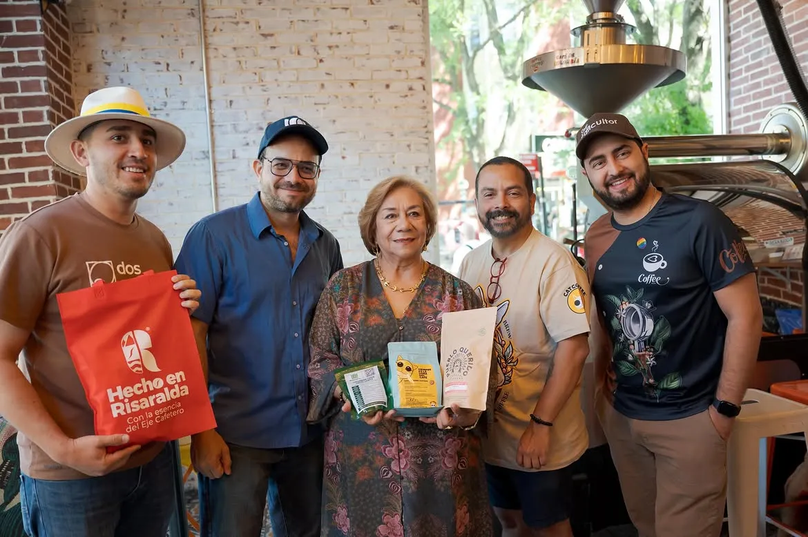 Colombia's Foreign Minister Yolanda Villavicencio holding a CatCoffee bag with the CatCoffee team during the Coffee Route in New York